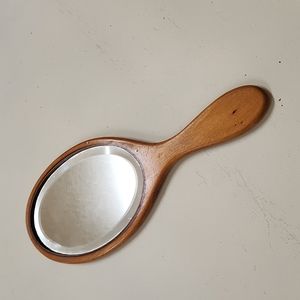 Antique wooden handle beveled mirror